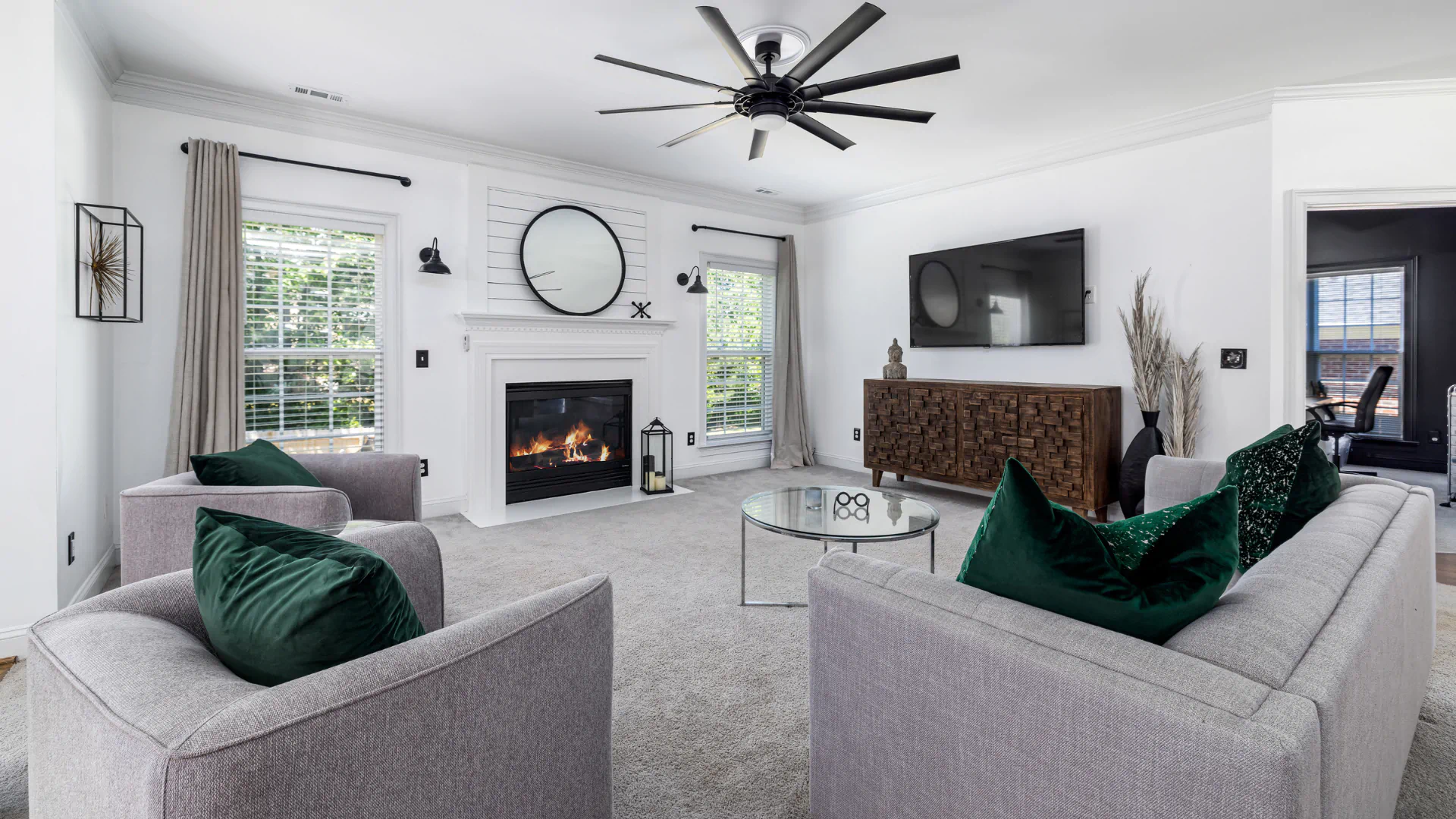clean living room with gray sofas and carpet